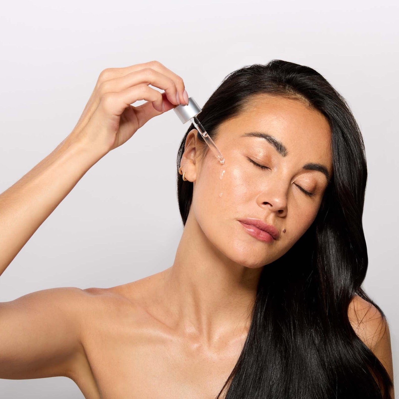 VITA BOOST SERUM AND MODEL