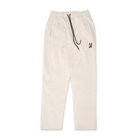 Comune Duke Sweatpants in heavyweight cotton with side gusset in bone color on white background, front view. COMUNE DUKE SWEATPANTS | Bone
