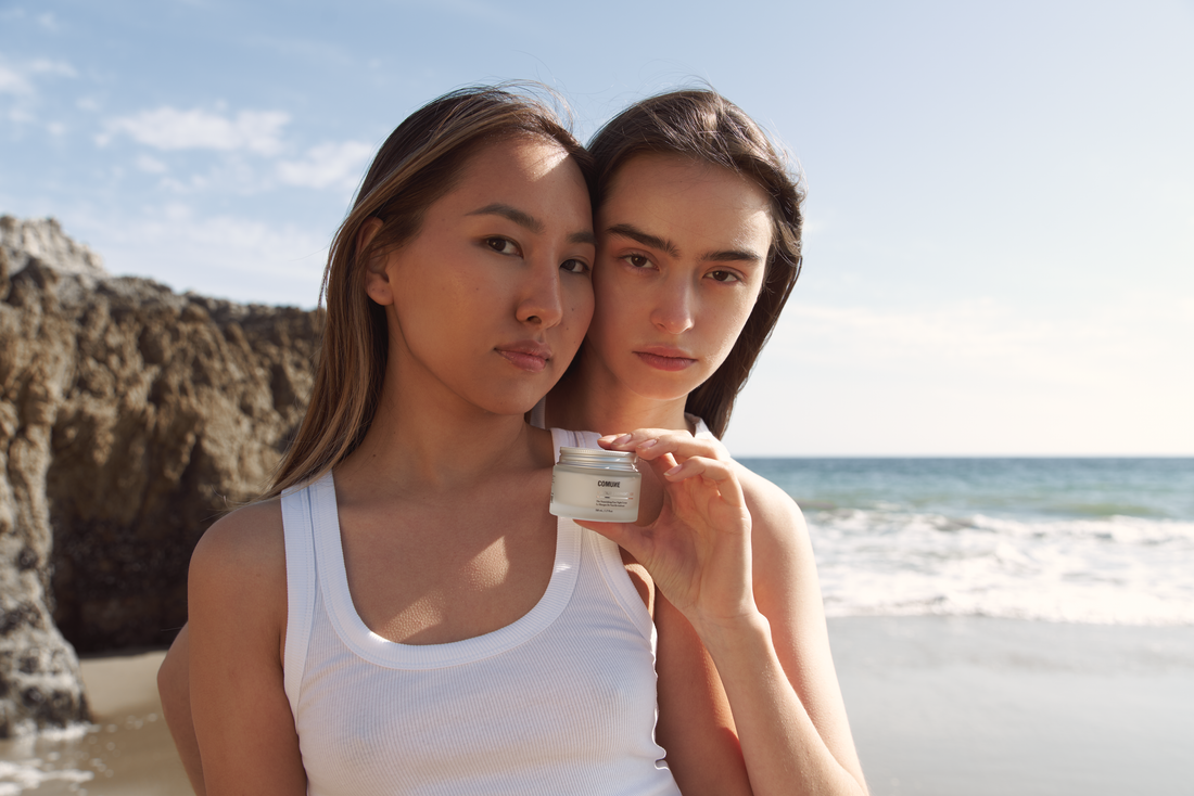 Comune Revitalize Overnight Mask held by two women at the beach