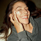 Women applying Comune Revitalize Overnight Mask