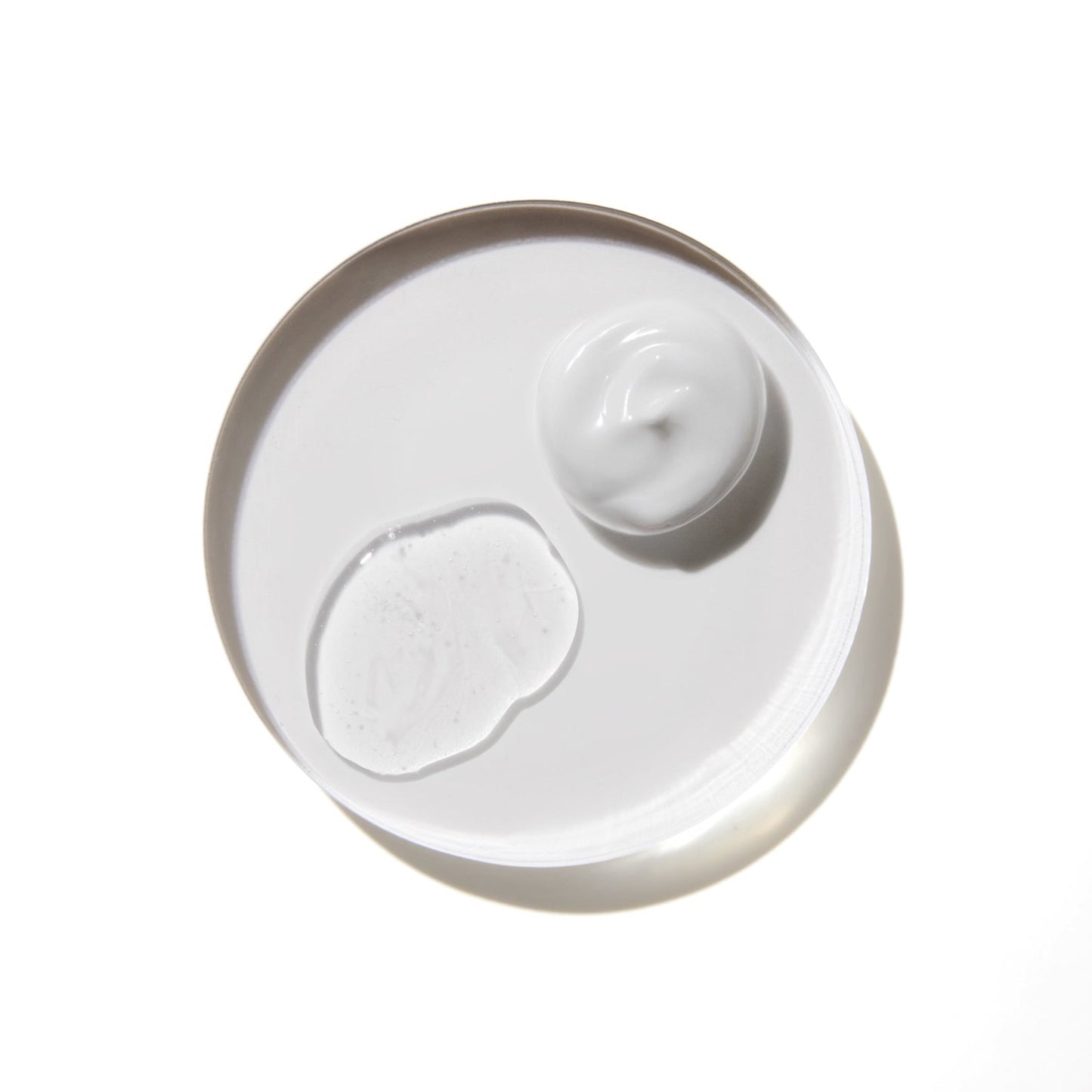 Comune Vita Boost Serum + Hydra Shroom Cream on white background in a glass container.