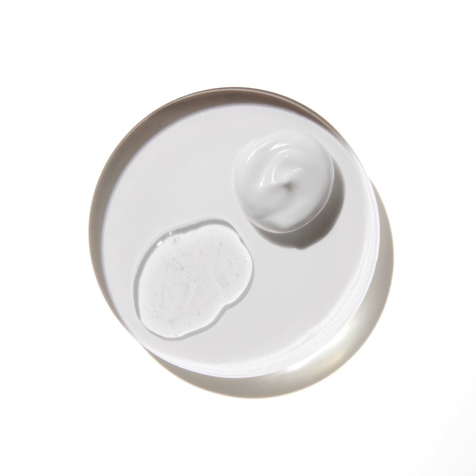 Comune Vita Boost Serum + Hydra Shroom Cream on white background in a glass container.