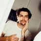 Comune model checking his face after cleansing his face with 'COMUNE' Essentials Face Cleanser