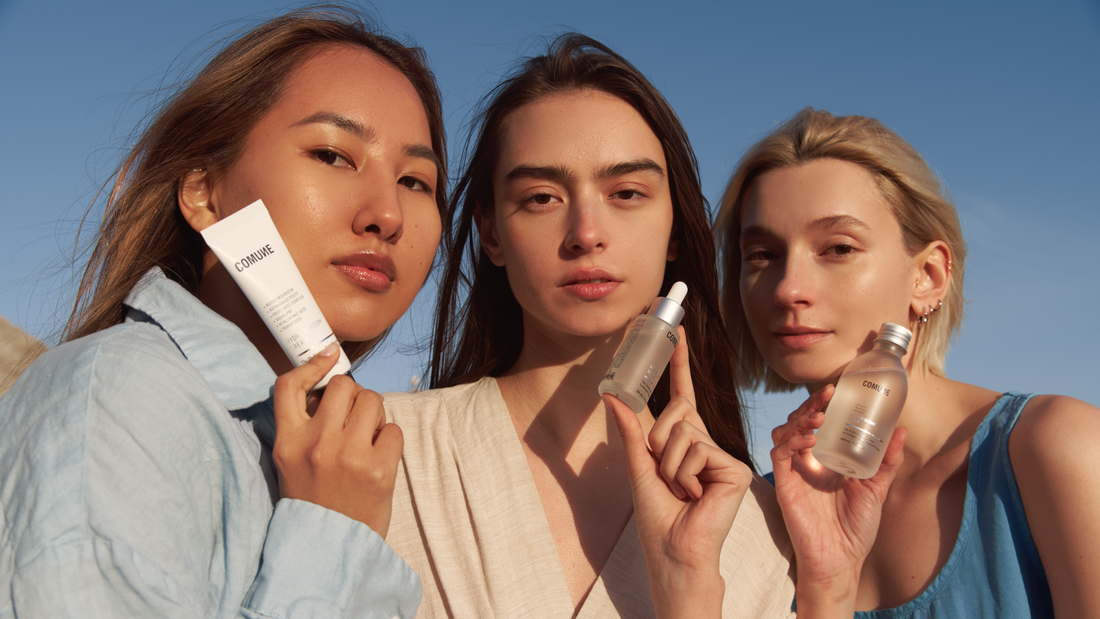 Comune Essentials Skincare held by three women