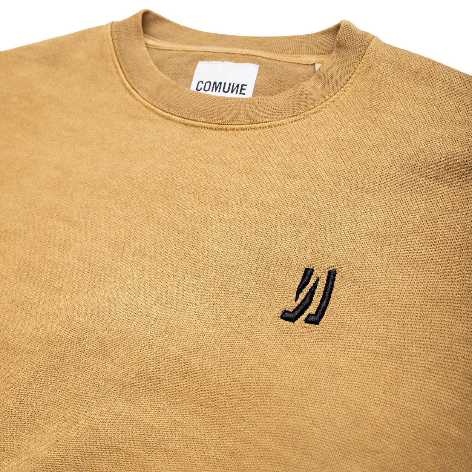 Comune Duke Crew heavyweight cotton in acorn color on white background, logo close up. COMUNE DUKE CREW | Acorn
