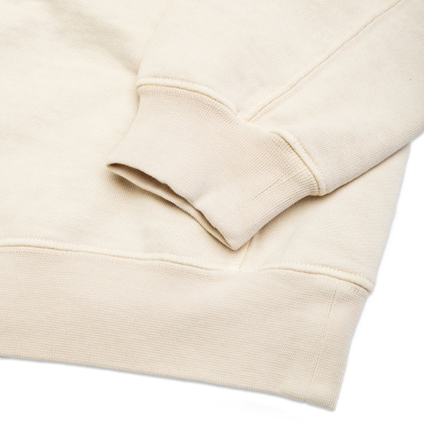 Comune Duke Crew heavyweight cotton in bone color on white background, hem close up. COMUNE DUKE CREW | Bone