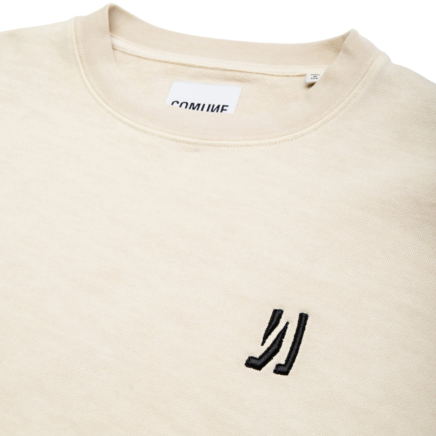 Comune Duke Crew heavyweight cotton in bone color on white background, logo close up. COMUNE DUKE CREW | Bone