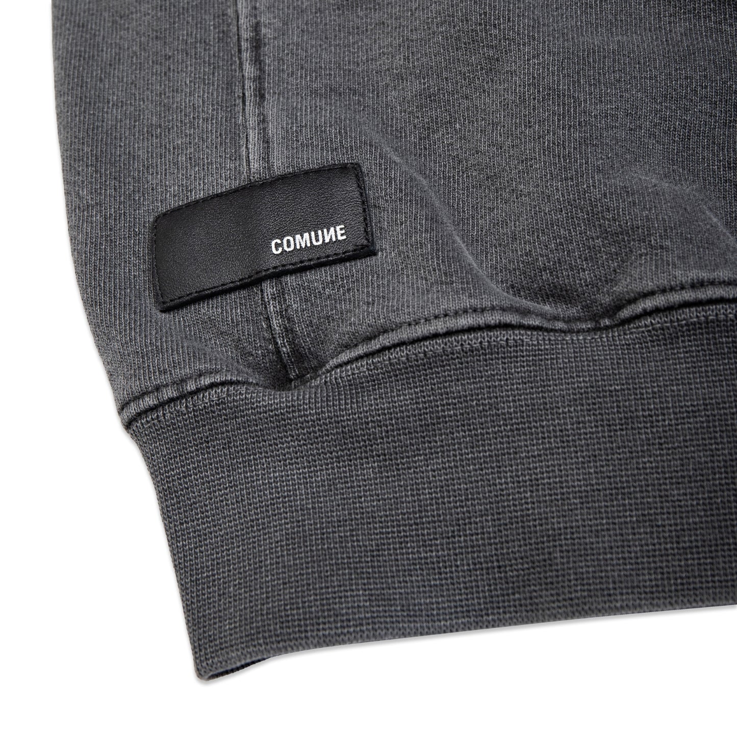 Comune Duke Crew heavyweight cotton in faded black color on white background, leather patch close up. COMUNE DUKE CREW | Faded Black