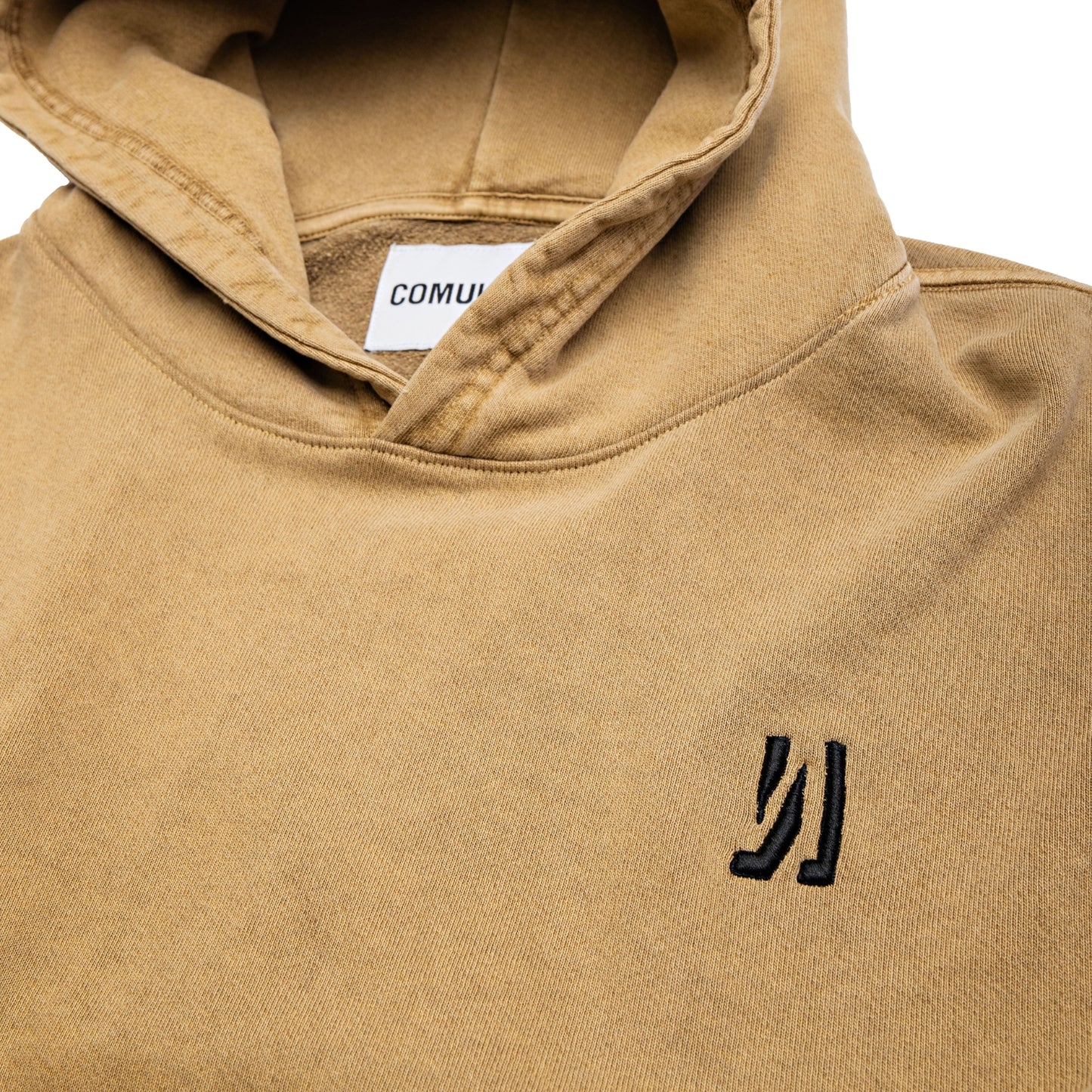 Comune Duke Hoodie heavyweight cotton in camel color on white background, logo close up. COMUNE DUKE HOODIE | Camel BRN