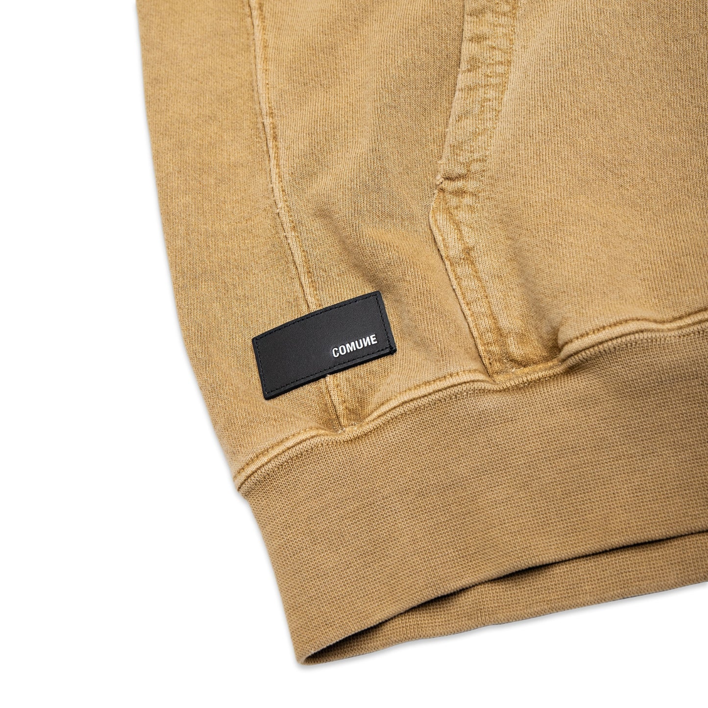 Comune Duke Hoodie heavyweight cotton in camel color on white background, leather patch close up. COMUNE DUKE HOODIE | Camel BRN