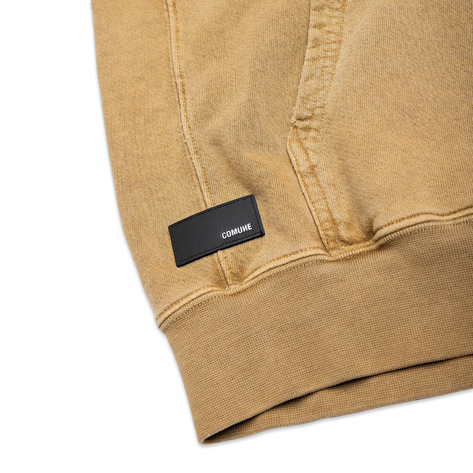 Comune Duke Hoodie heavyweight cotton in camel color on white background, leather patch close up. COMUNE DUKE HOODIE | Camel BRN