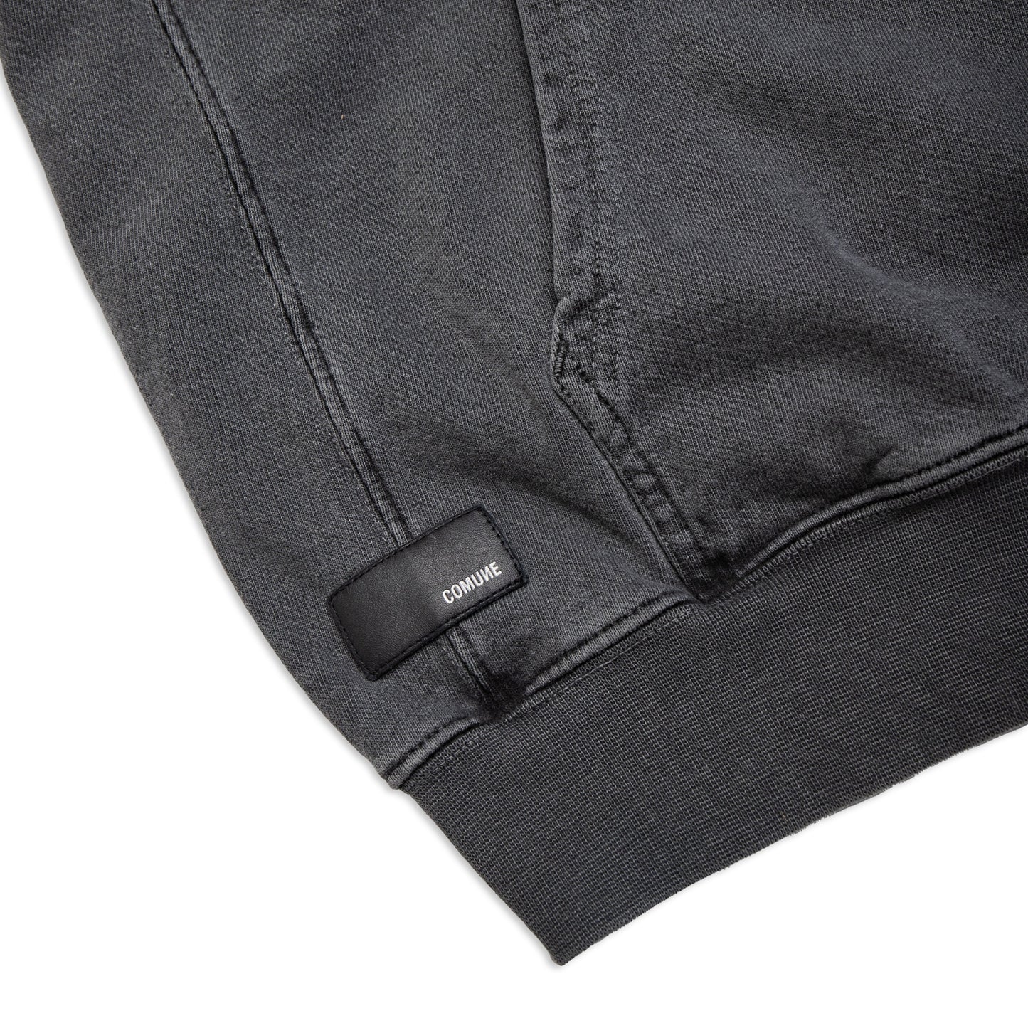 Comune Duke Hoodie heavyweight cotton in camel color on white background, leather patch close up. COMUNE DUKE HOODIE | Faded Black