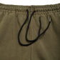 Comune Duke Sweatpants in heavyweight cotton with side gusset in army green color on white background, drawcord close up. COMUNE DUKE SWEATPANTS | Army Green