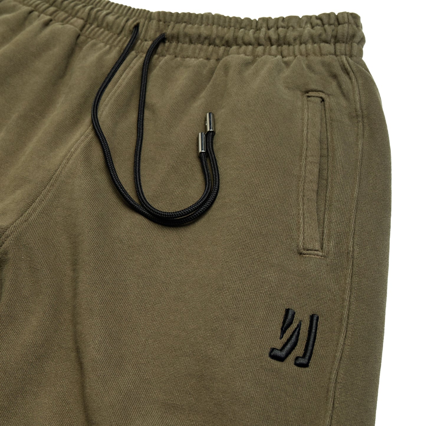 Comune Duke Sweatpants in heavyweight cotton with side gusset in army green color on white background, drawcord close up. COMUNE DUKE SWEATPANTS | Army Green