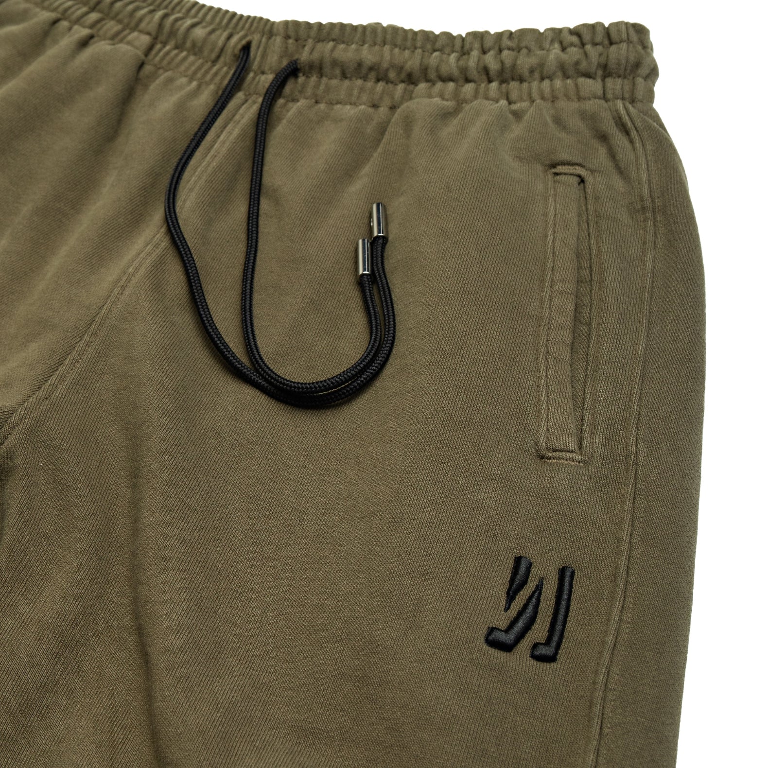 Comune Duke Sweatpants in heavyweight cotton with side gusset in army green color on white background, drawcord close up. COMUNE DUKE SWEATPANTS | Army Green