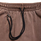 Comune Enzo Joggers heavyweight cotton in brown color on white background, drawcord close up. COMUNE ENZO JOGGER | Brown
