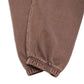 Comune Enzo Joggers heavyweight cotton in brown color on white background, hem close up. COMUNE ENZO JOGGER | Brown