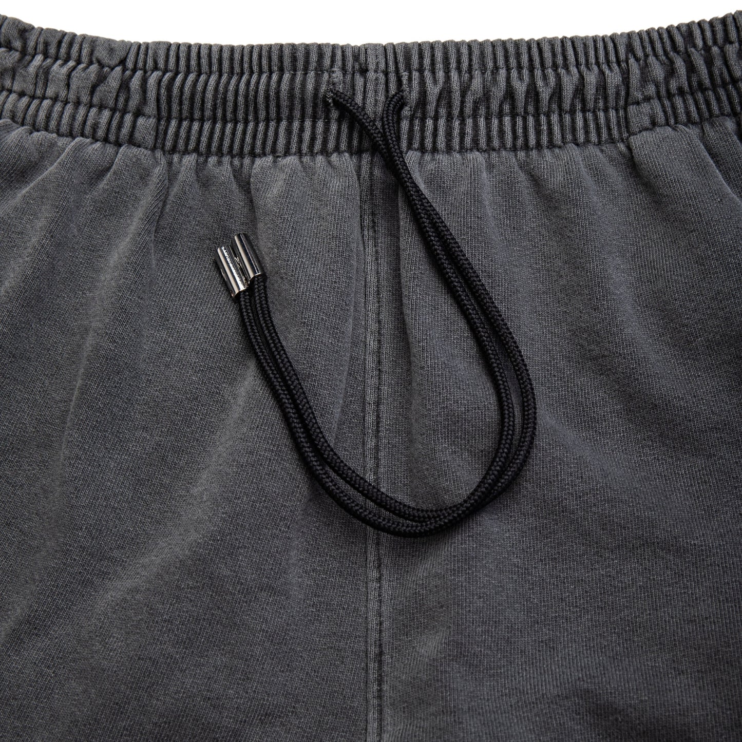 Comune Enzo Joggers heavyweight cotton in faded black color on white background, drawcord close up. COMUNE ENZO JOGGER | Faded Black