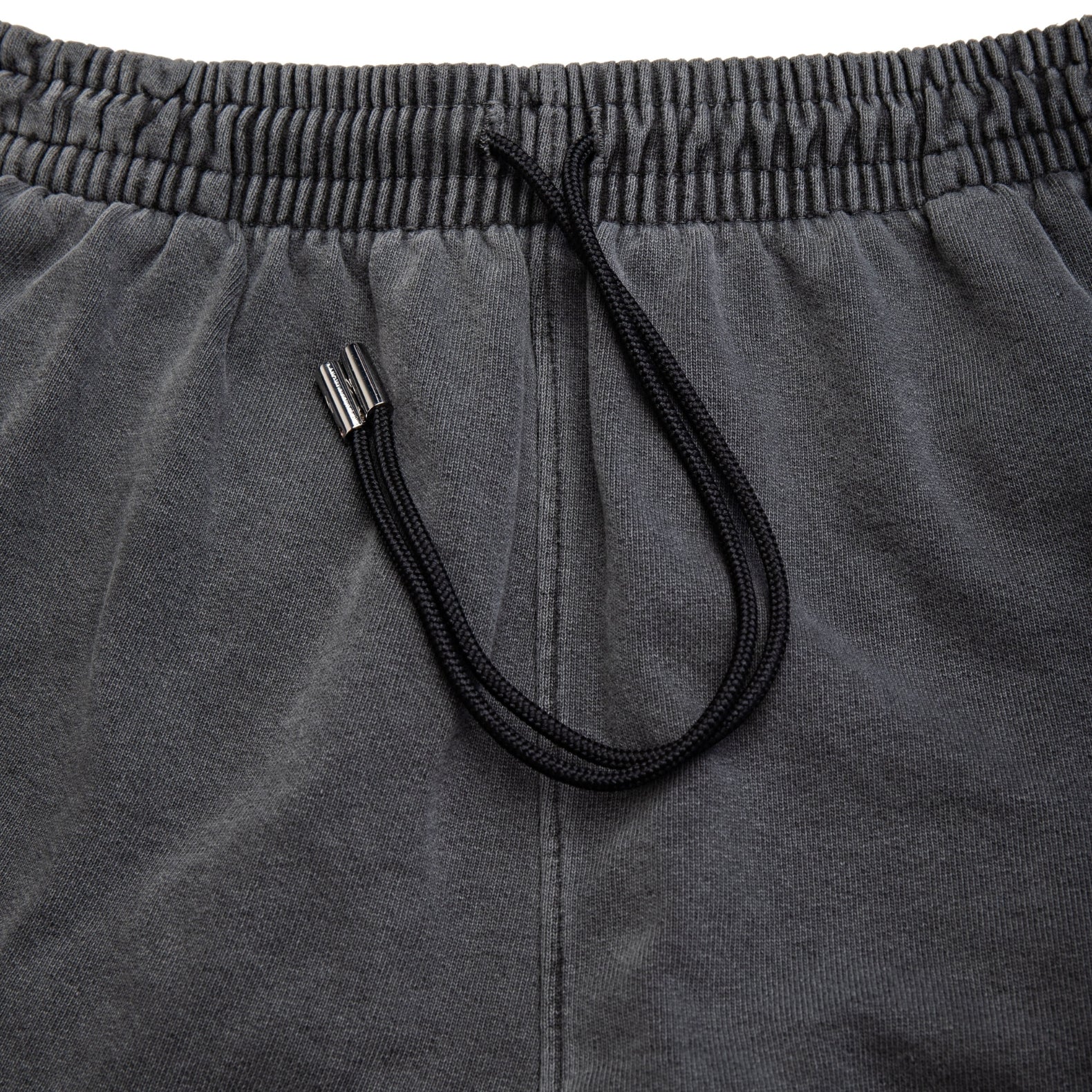 Comune Enzo Joggers heavyweight cotton in faded black color on white background, drawcord close up. COMUNE ENZO JOGGER | Faded Black