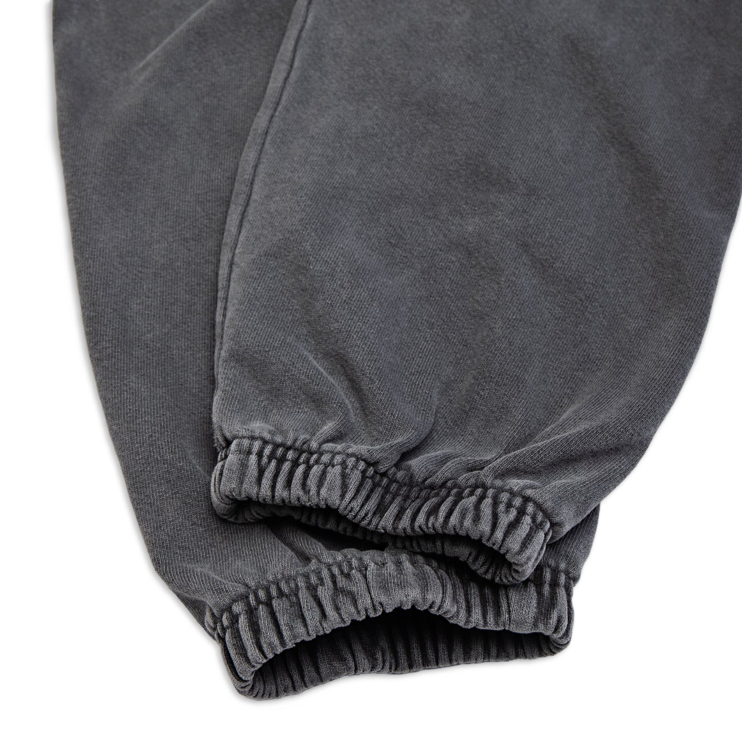 Comune Enzo Joggers heavyweight cotton in faded black color on white background, hem close up. COMUNE ENZO JOGGER | Faded Black