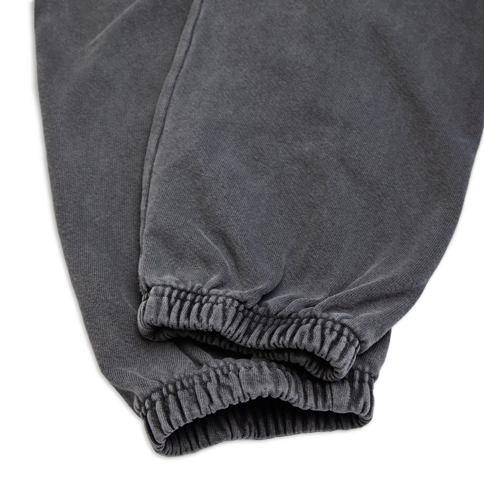 Comune Enzo Joggers heavyweight cotton in faded black color on white background, hem close up. COMUNE ENZO JOGGER | Faded Black