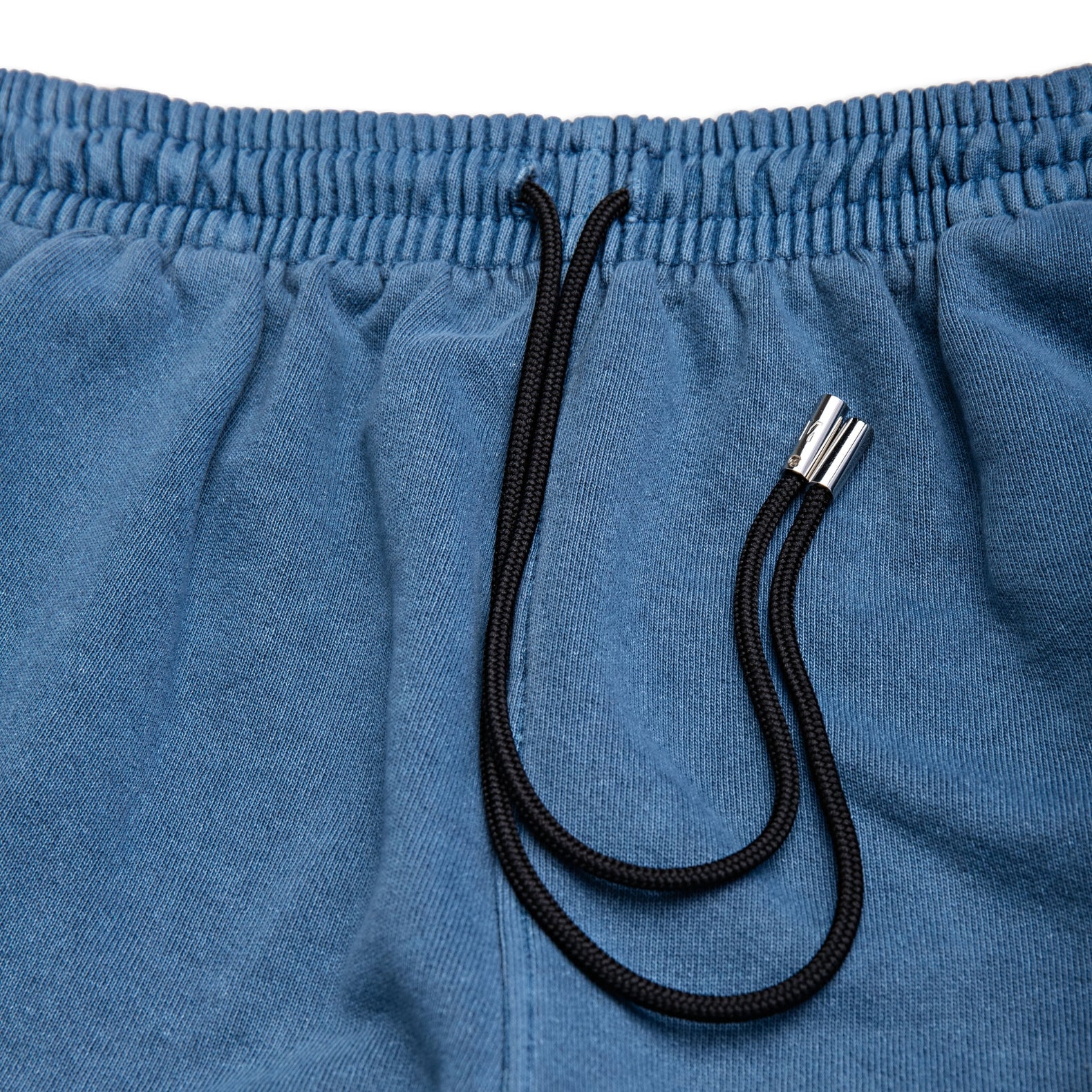 Comune Enzo Joggers heavyweight cotton in marine color on white background, drawcord close up. COMUNE ENZO JOGGER | Marine