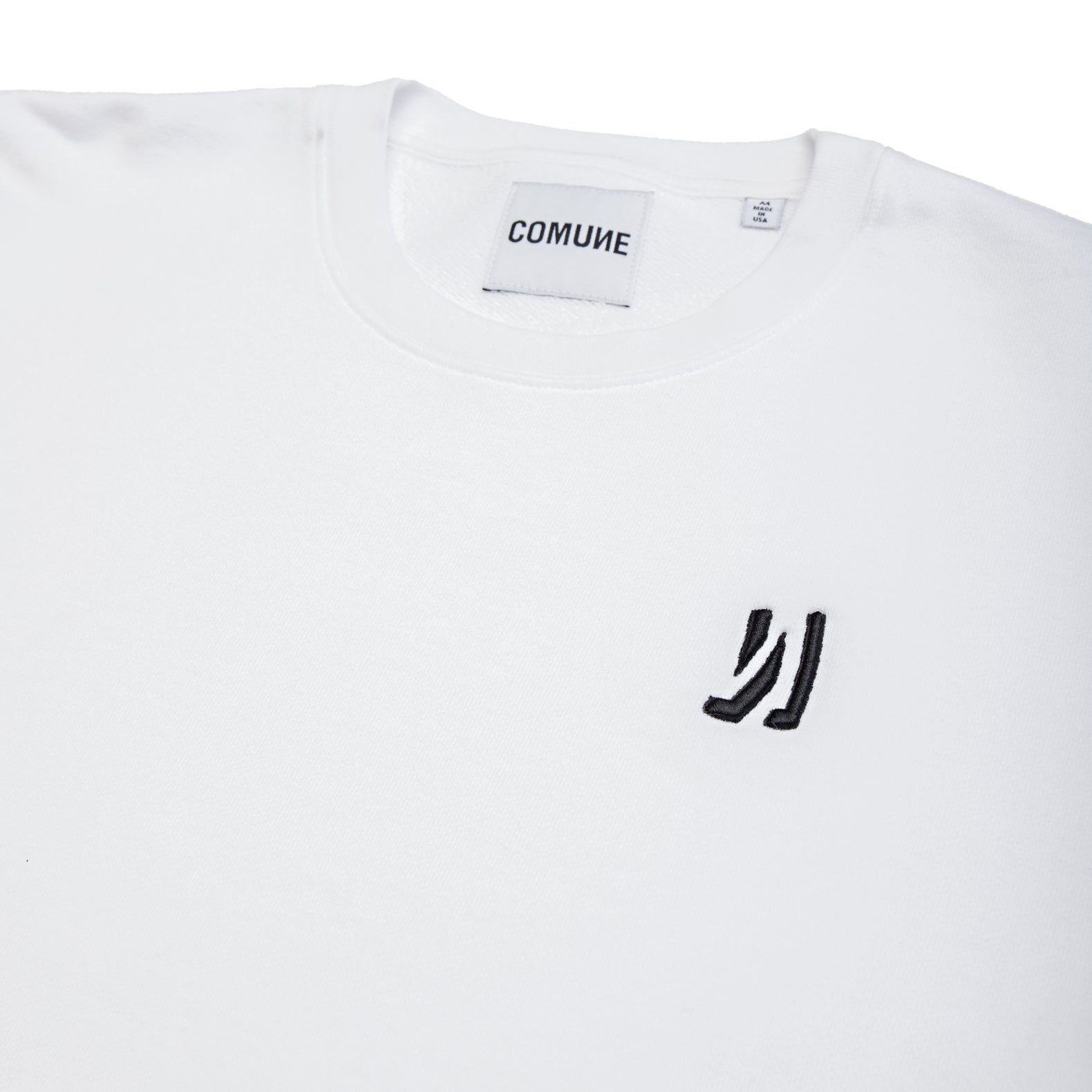 Comune Luka crewneck heavyweight cotton sweatshirt in white color on white background, close up front logo. COMUNE LUKA CREW | White