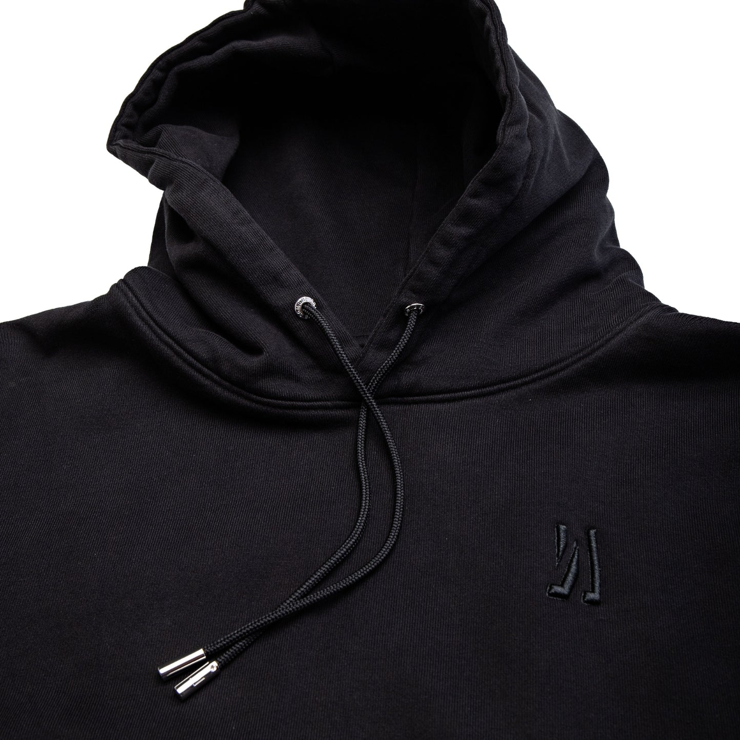 Comune Luka Hoodie heavyweight cotton sweatshirt in black color on white background, logo close up. COMUNE LUKA HOODIE | Black
