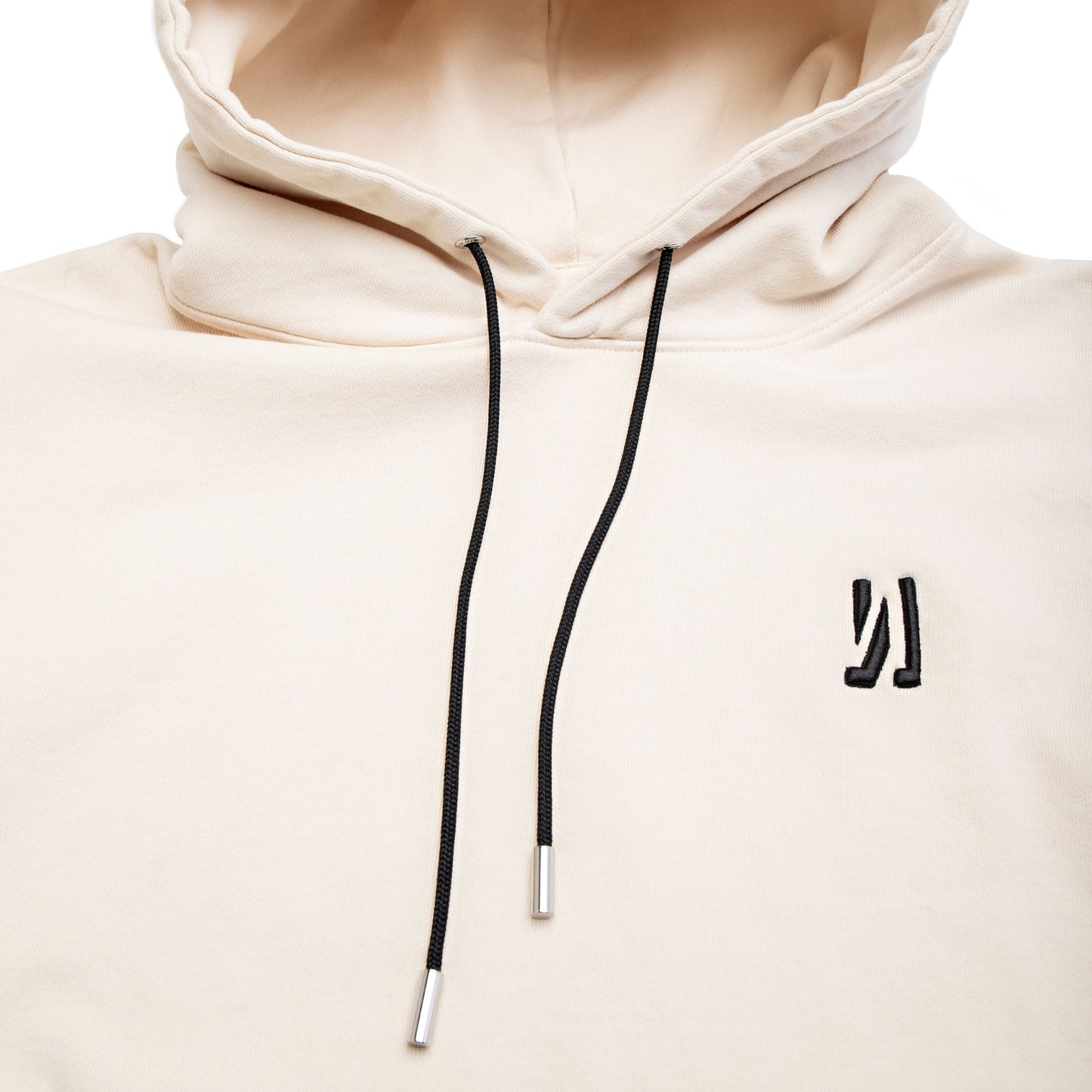 Comune Luka Hoodie heavyweight cotton sweatshirt in bone color on white background, logo close up. COMUNE LUKA HOODIE | Bone