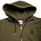 Comune Luka Zip-up heavyweight cotton hoodie in army green color on a white background, logo close up. COMUNE LUKA ZIP-UP | Army Green