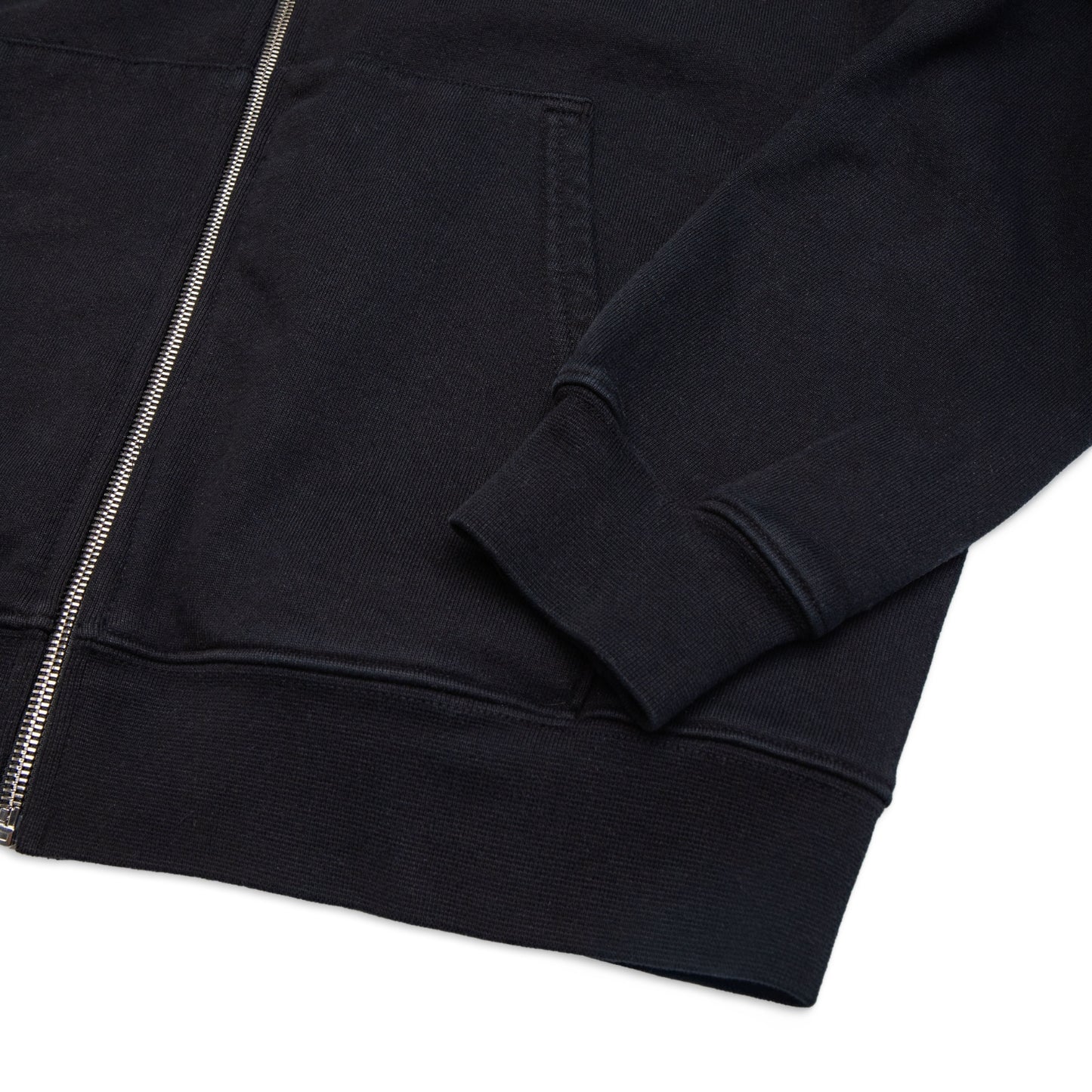 Comune Luka Zip-up heavyweight cotton hoodie in black color on a white background, hem close up. COMUNE LUKA ZIP-UP | Black