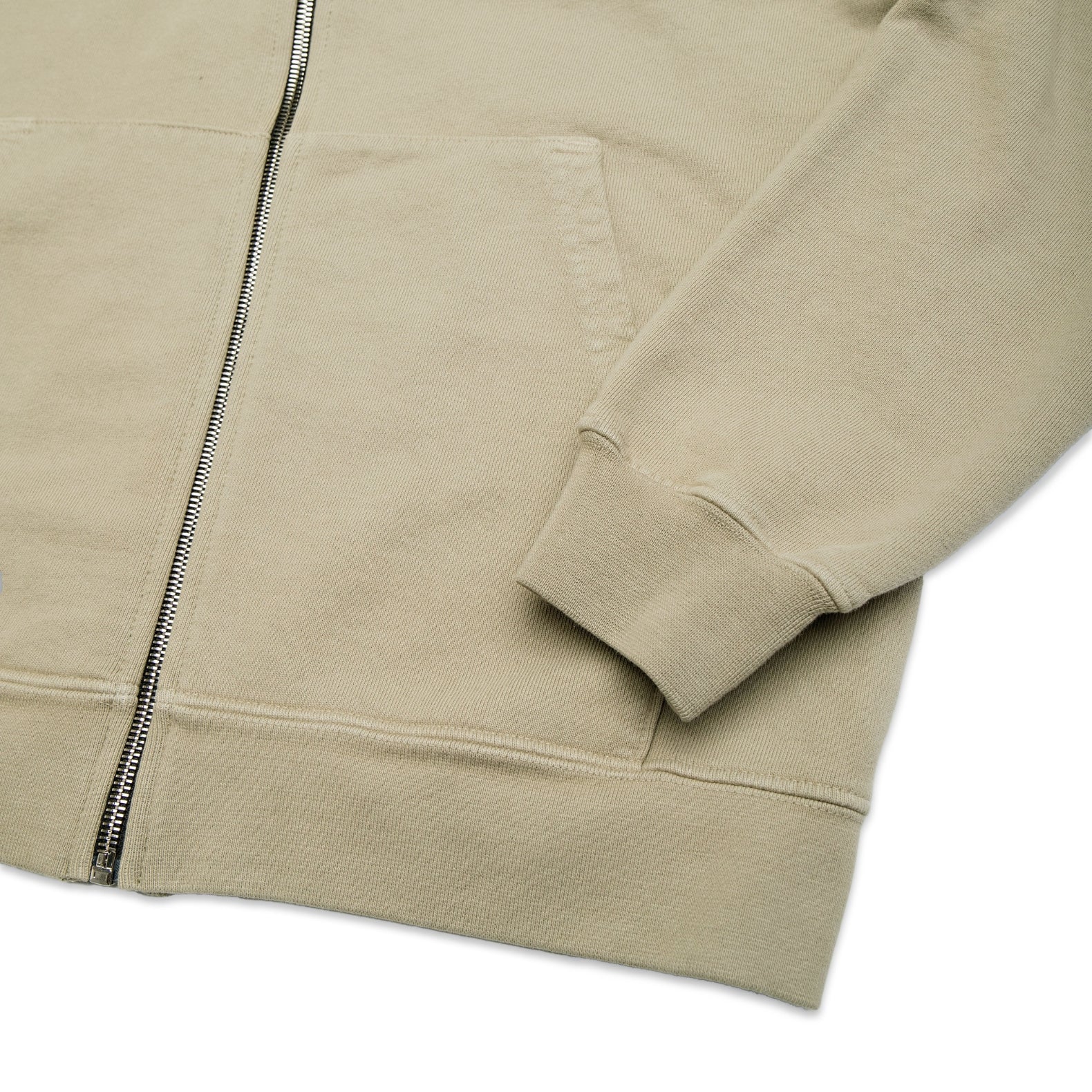 Comune Luka Zip-up in heavyweight cotton hoodie in sage color on white background, hem close up. COMUNE LUKA ZIP-UP | Sage