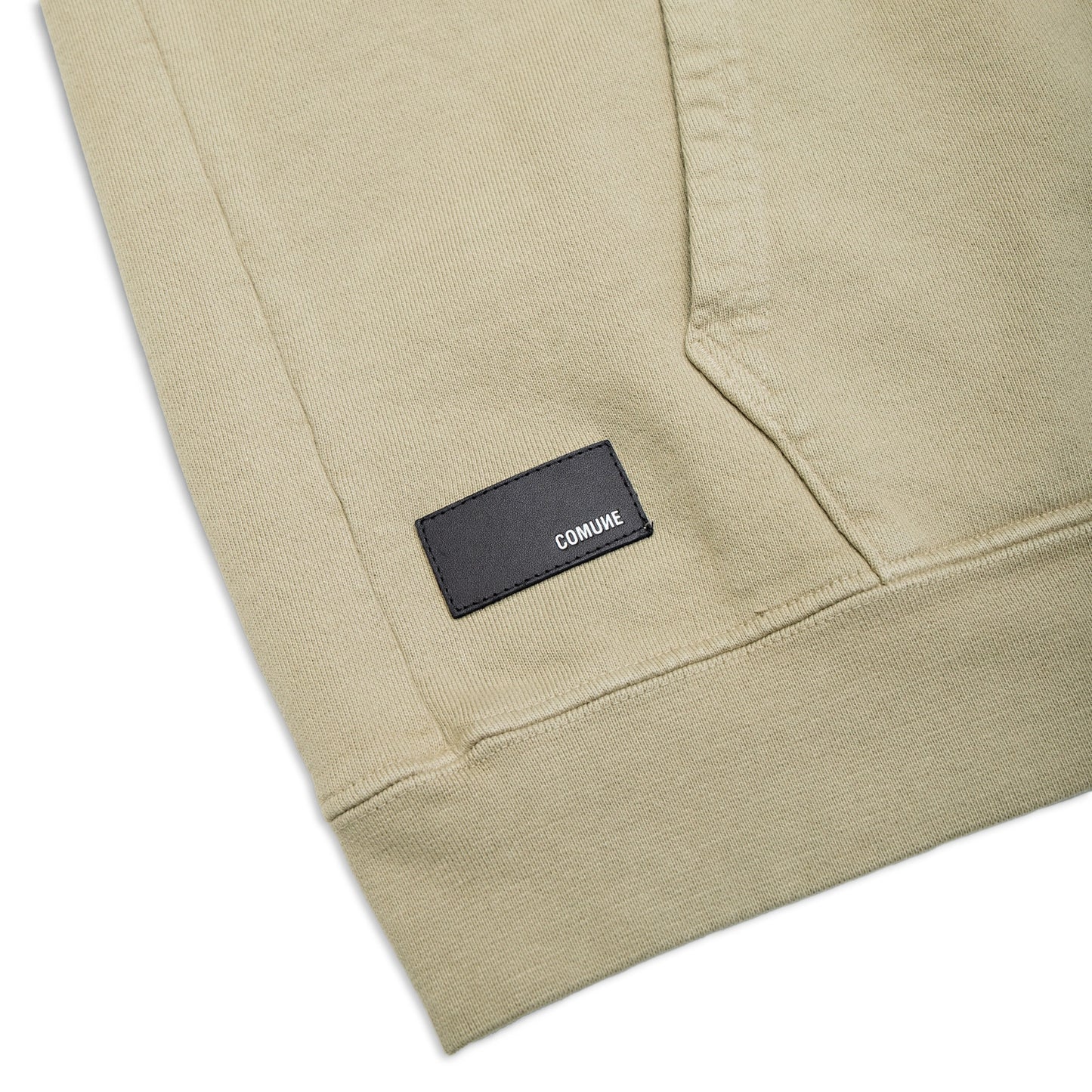 Comune Luka Zip-up in heavyweight cotton hoodie in sage color on white background, leather patch close up. COMUNE LUKA ZIP-UP | Sage