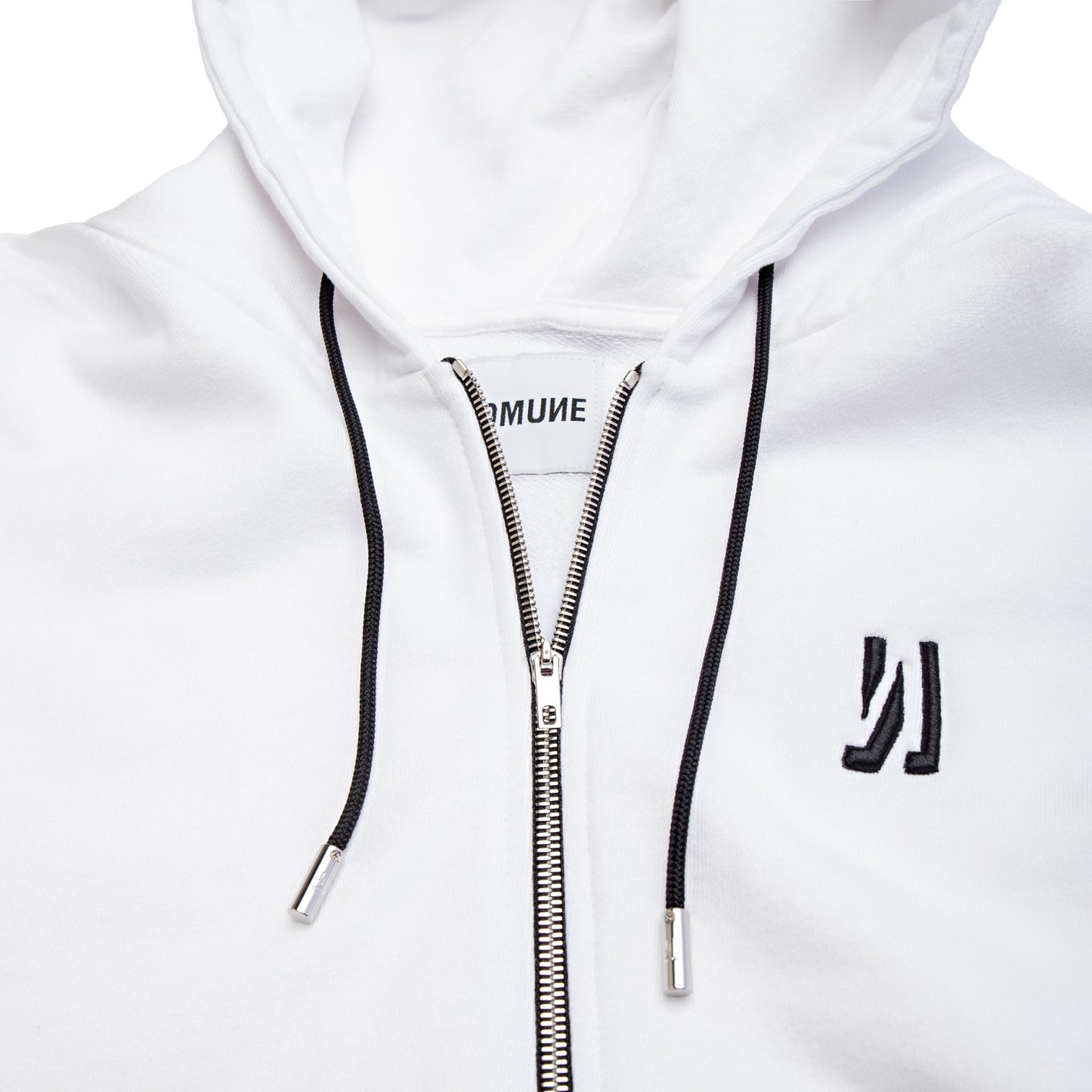 Comune Luka Zip-up in heavyweight cotton hoodie in white color on white background, logo close up. COMUNE LUKA ZIP-UP | White