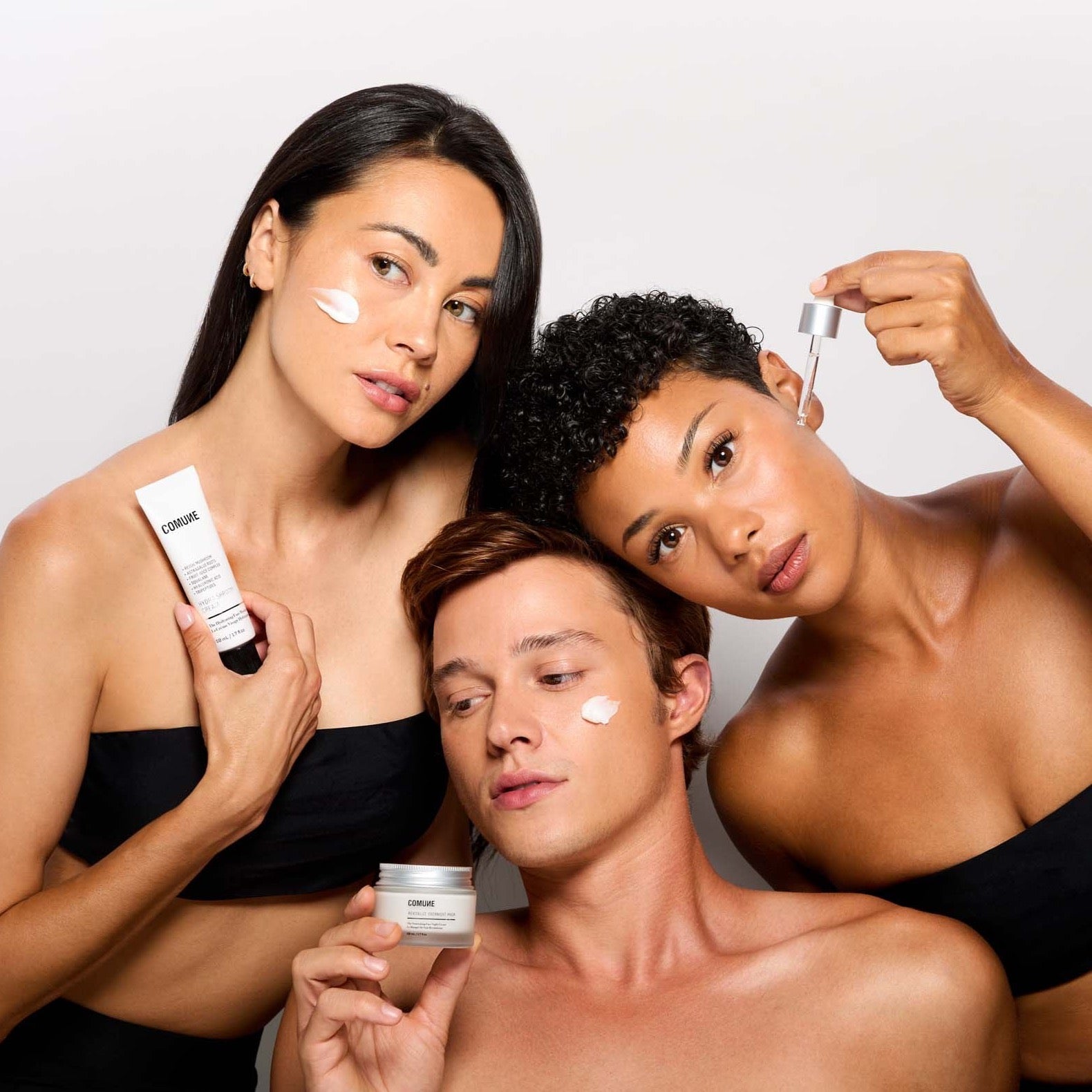 Comune Models holding Hydra Shroom Cream + Vita Boost Serum + Revitalize Overnight Mask