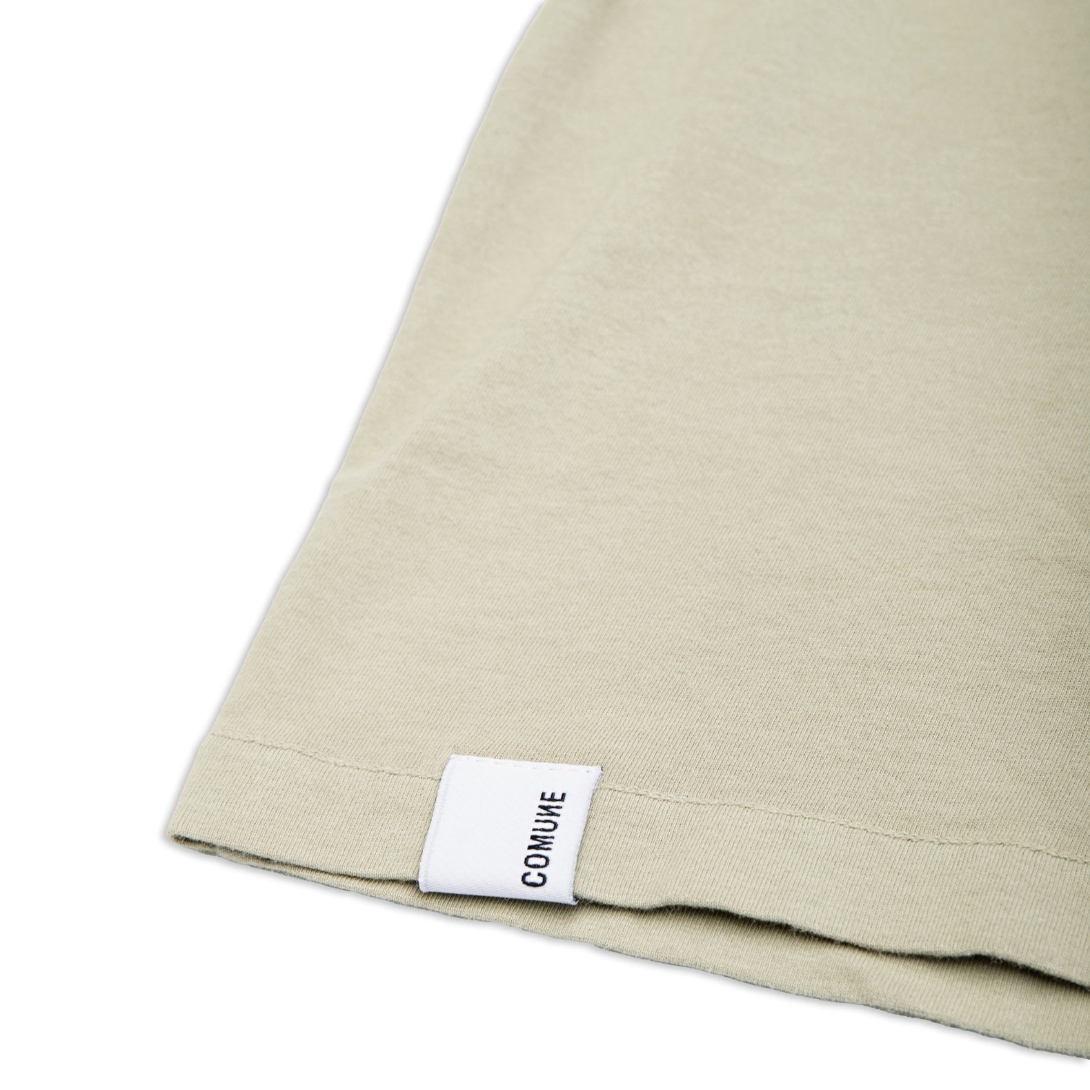 Comune Nori oversized tee in soft 100% supima cotton in sage color on white background, label and hem close up. COMUNE NORI OVERSIZED TEE | Sage