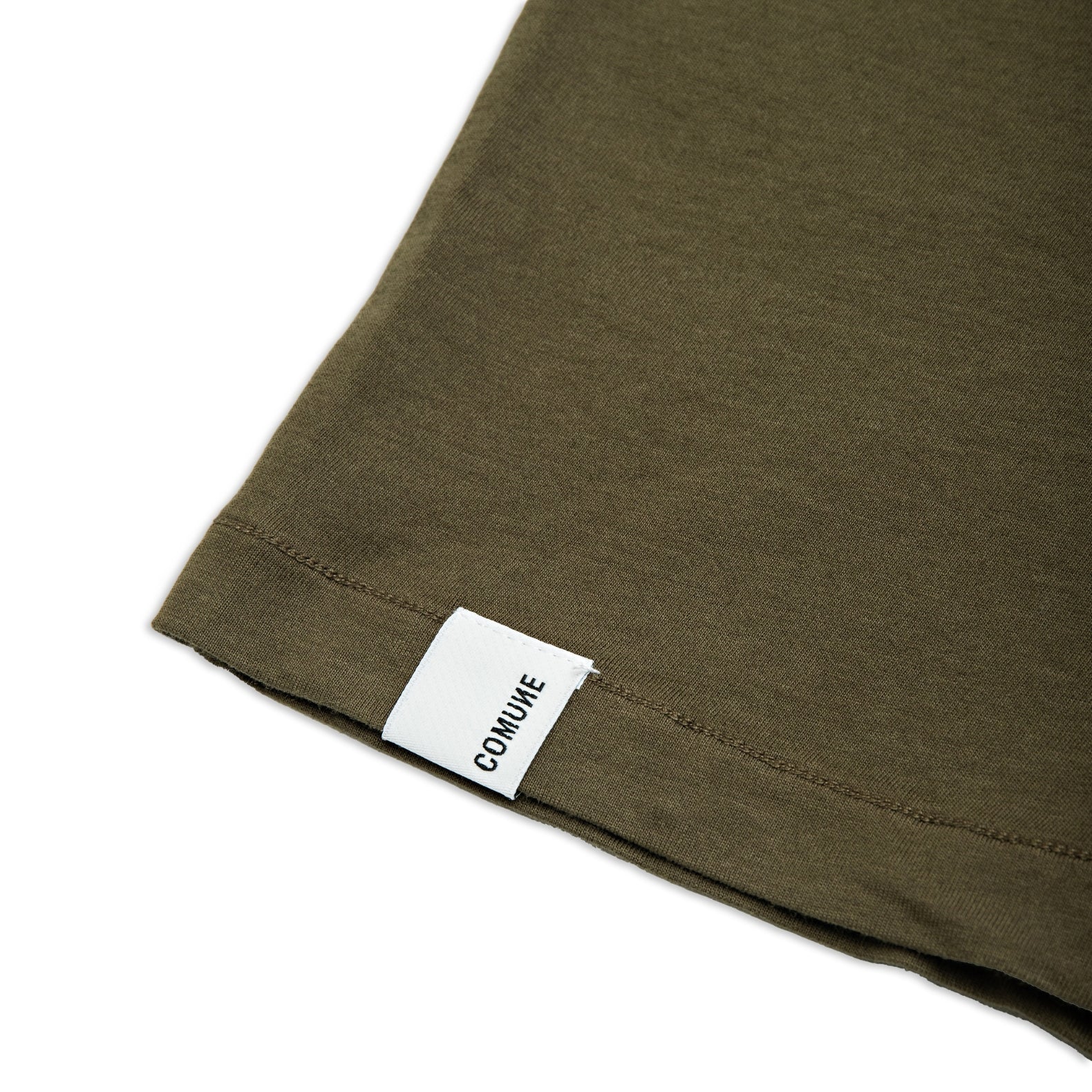Comune Nori tee in soft 100% supima cotton in army green color on white background, label and hem close up. COMUNE NORI TEE | Army Green