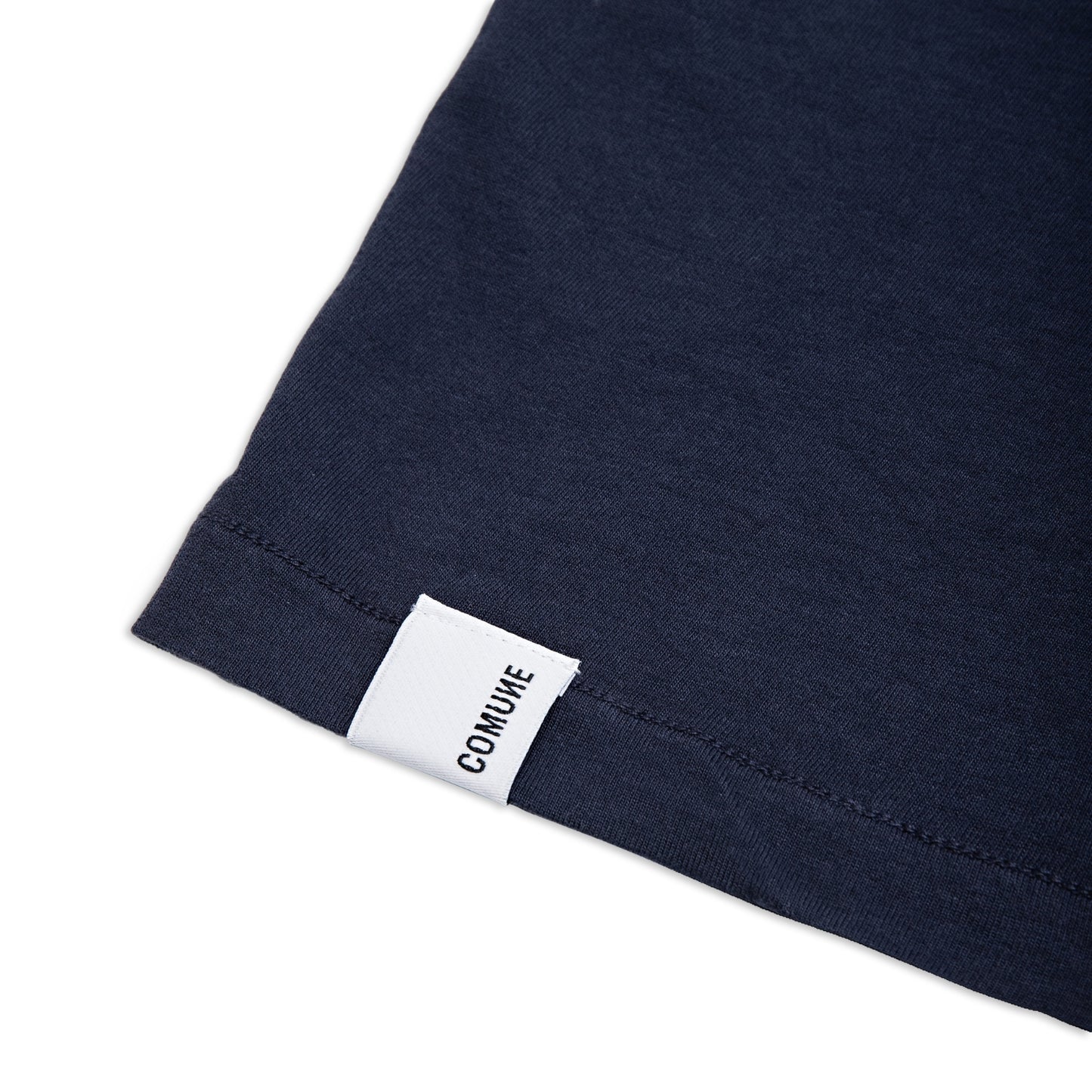 Comune Nori tee in soft 100% supima cotton in black color on white background, label and hem close up. COMUNE NORI TEE | Navy