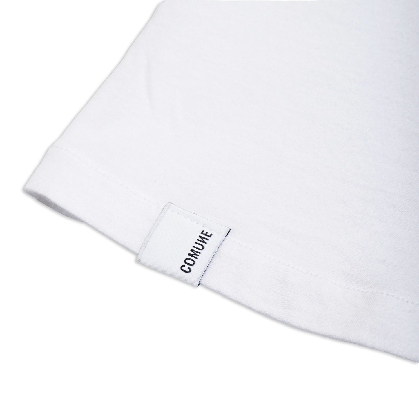Comune Nori tee in soft 100% supima cotton in white color on white background, label and hem close up. COMUNE NORI TEE | White