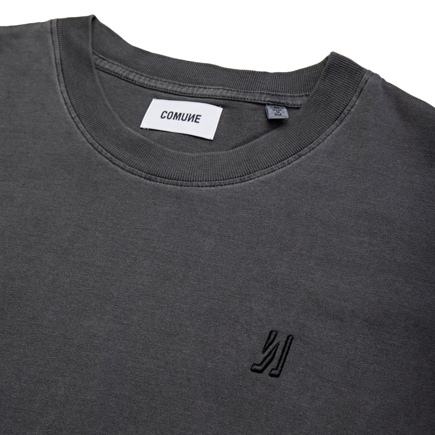 Comune Ryder oversized tee in soft 100% cotton in white color on white background, logo close up. COMUNE RYDER OVERSIZED TEE | Faded Black