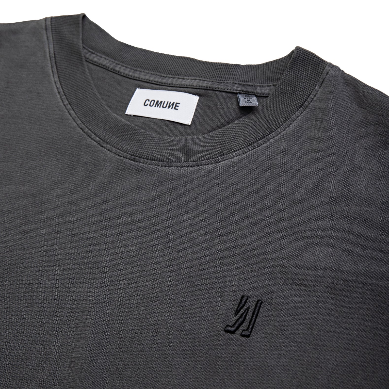 Comune Ryder oversized tee in soft 100% cotton in white color on white background, logo close up. COMUNE RYDER OVERSIZED TEE | Faded Black