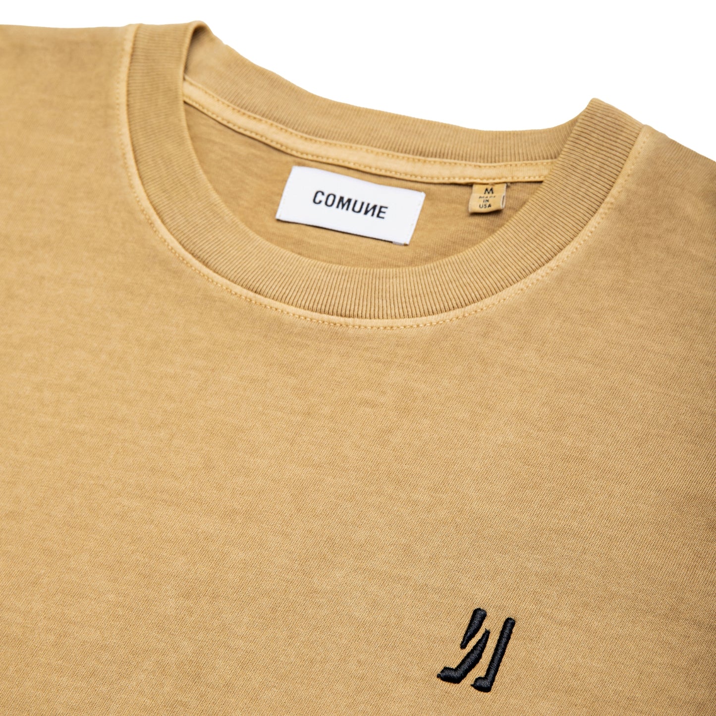 Comune Ryder tee in soft 100% cotton in acorn color on white background, logo close up. COMUNE RYDER TEE | Acorn