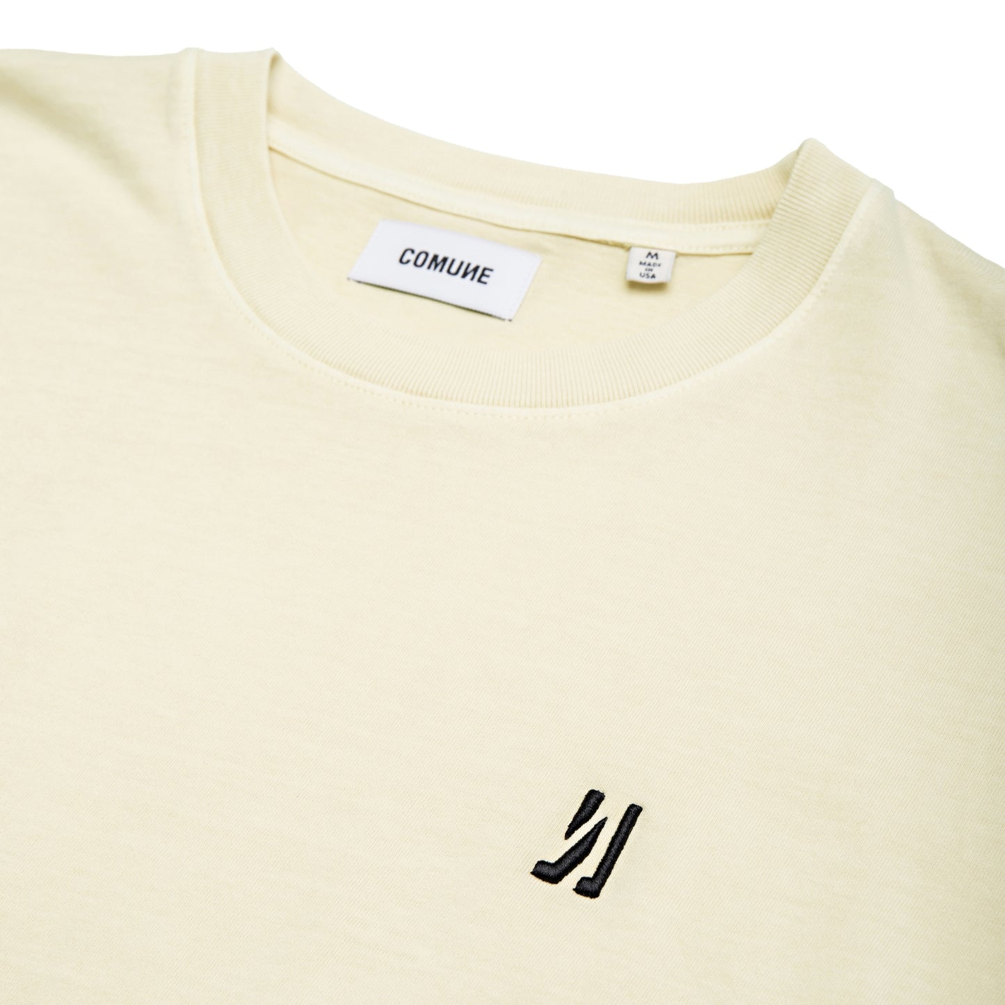 Comune Ryder tee in soft 100% cotton in bone color on white background, logo close up. COMUNE RYDER TEE | Bone