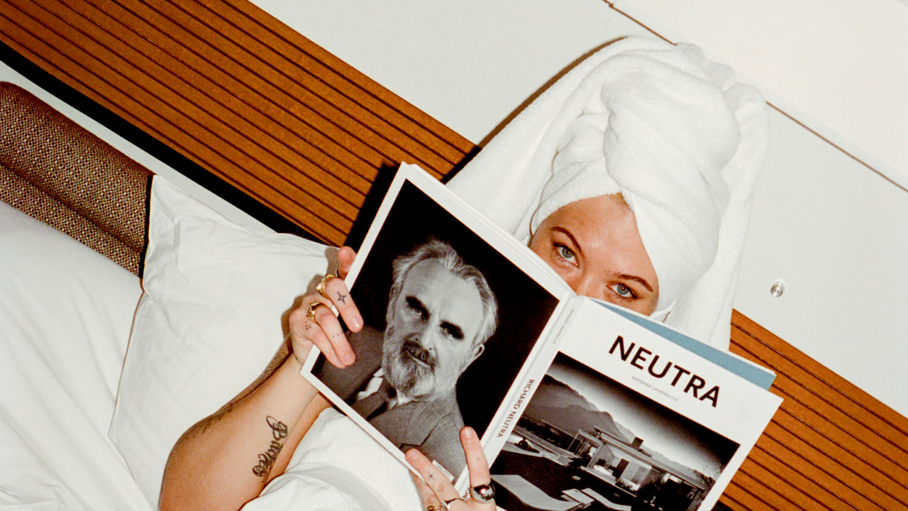 COMUNE model holding a book before bed