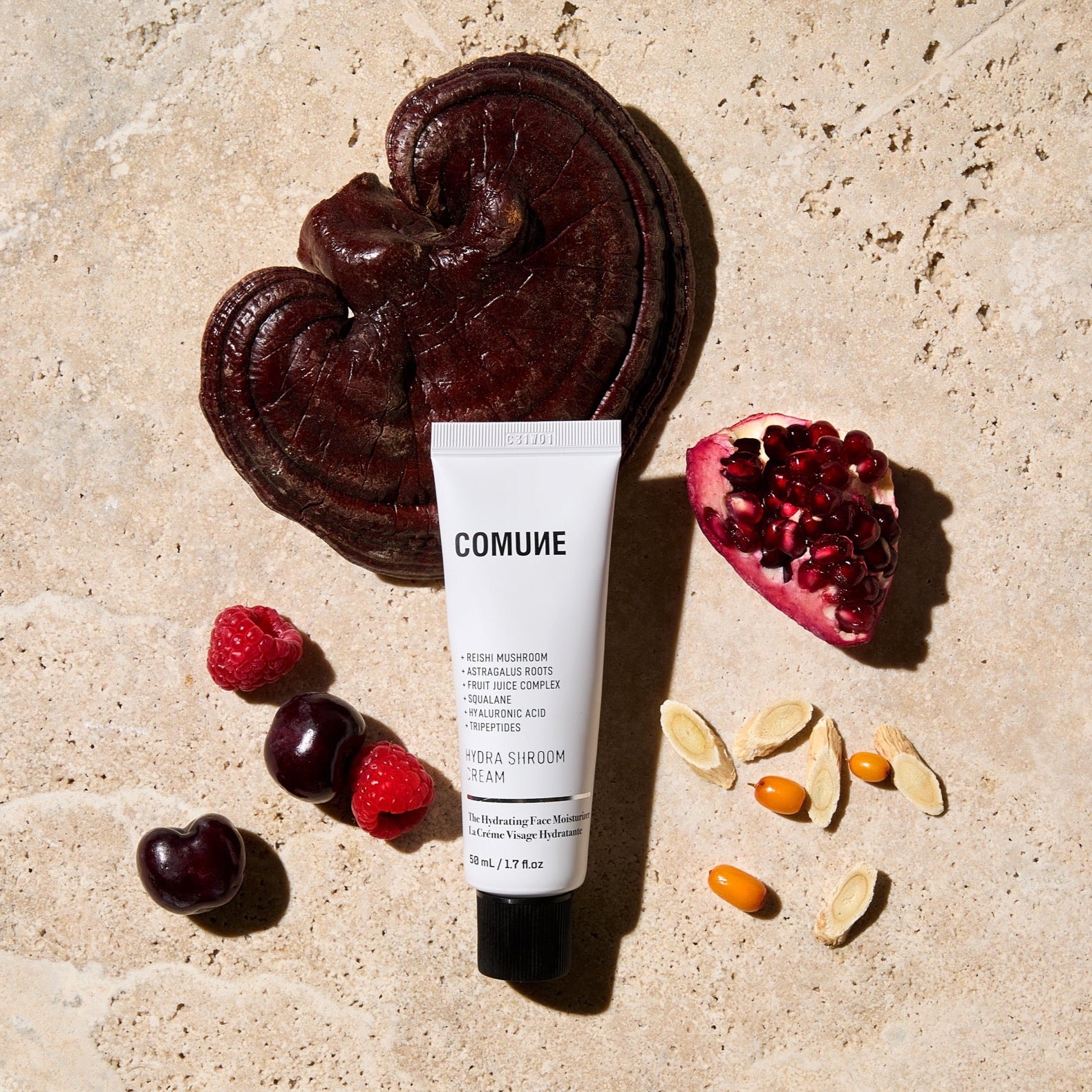Comune Hydra Shroom Crem 50mL / 1.7 fl.oz, on natural stone background with actual ingredients.  An hydrating face cream with reishi mushroom, astragalus roots, superfood complex, squalane, hyaluronic acid, and tripeptides.  Clean, natural, vegan & cruelty-free.